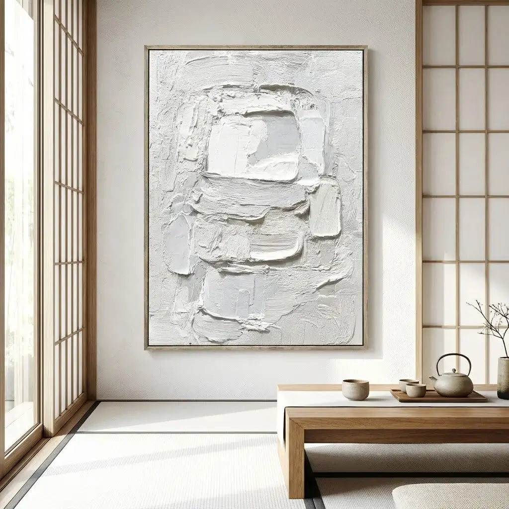 Abstract white painting on a wall in a minimalistic room with wooden furniture and tea set.