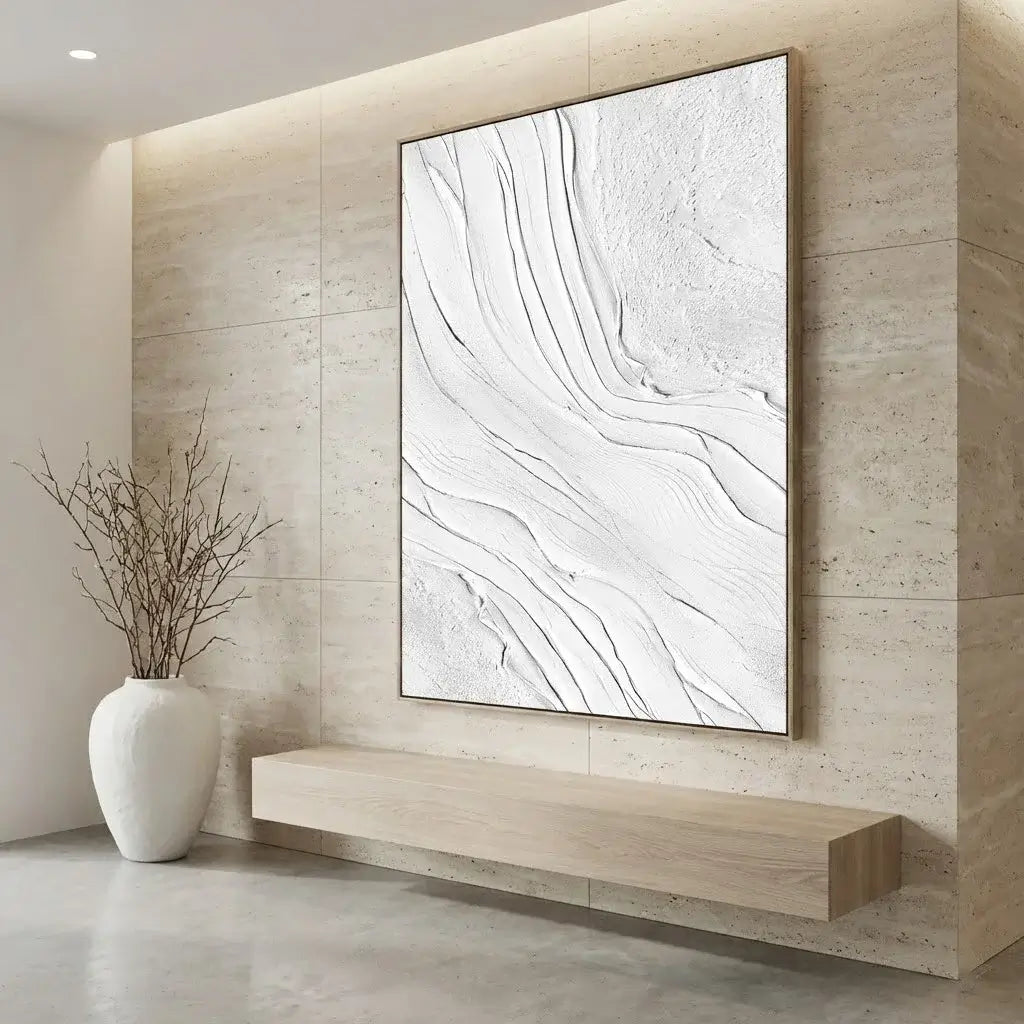 Modern interior with abstract artwork on a wall, white vase with branches, and floating shelf.