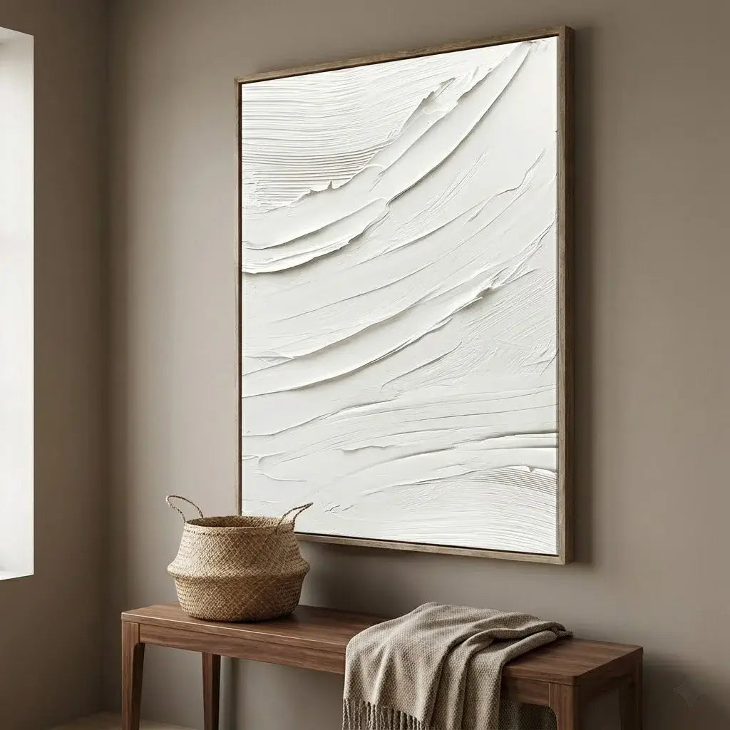 Abstract painting on a wall above a wooden bench with a woven basket and a blanket.