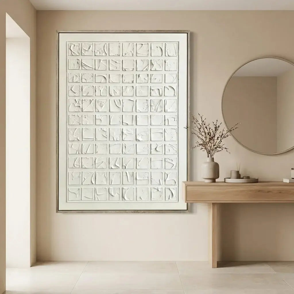 Modern interior with abstract wall art, round mirror, and wooden console table.