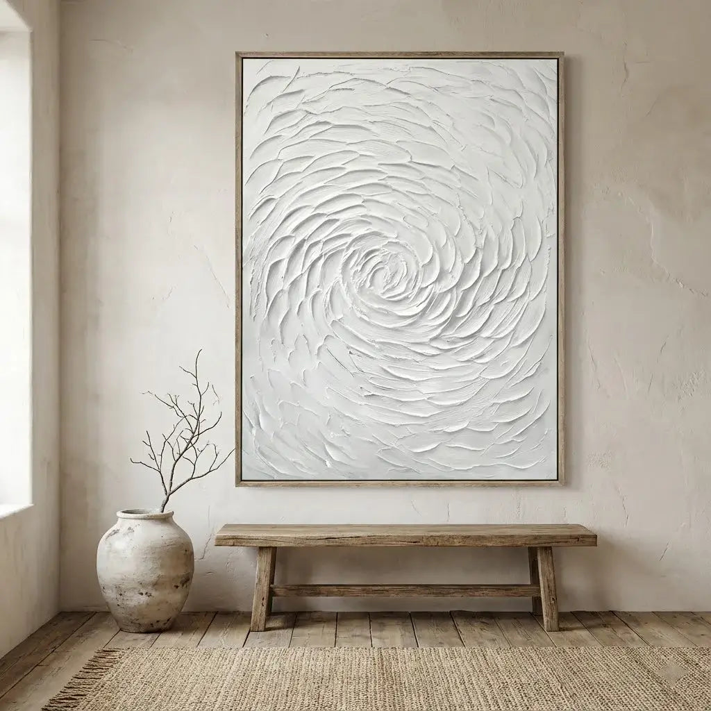 Abstract wall art with swirling patterns in a minimalistic room with a wooden bench and vase.