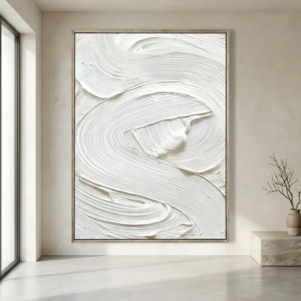 Abstract white painting on a beige wall in a modern interior setting