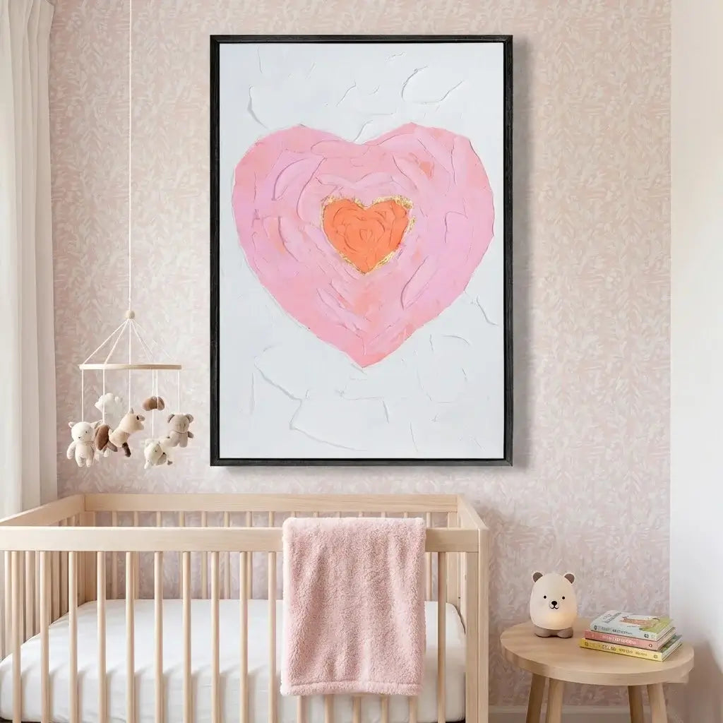 Heart-shaped artwork in a nursery with a crib and toys.