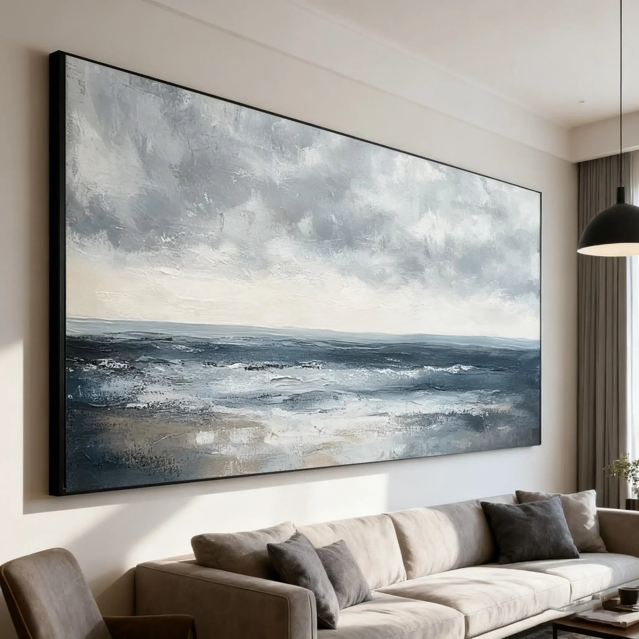 Large abstract painting of a stormy sea on a wall above a sofa in a living room.