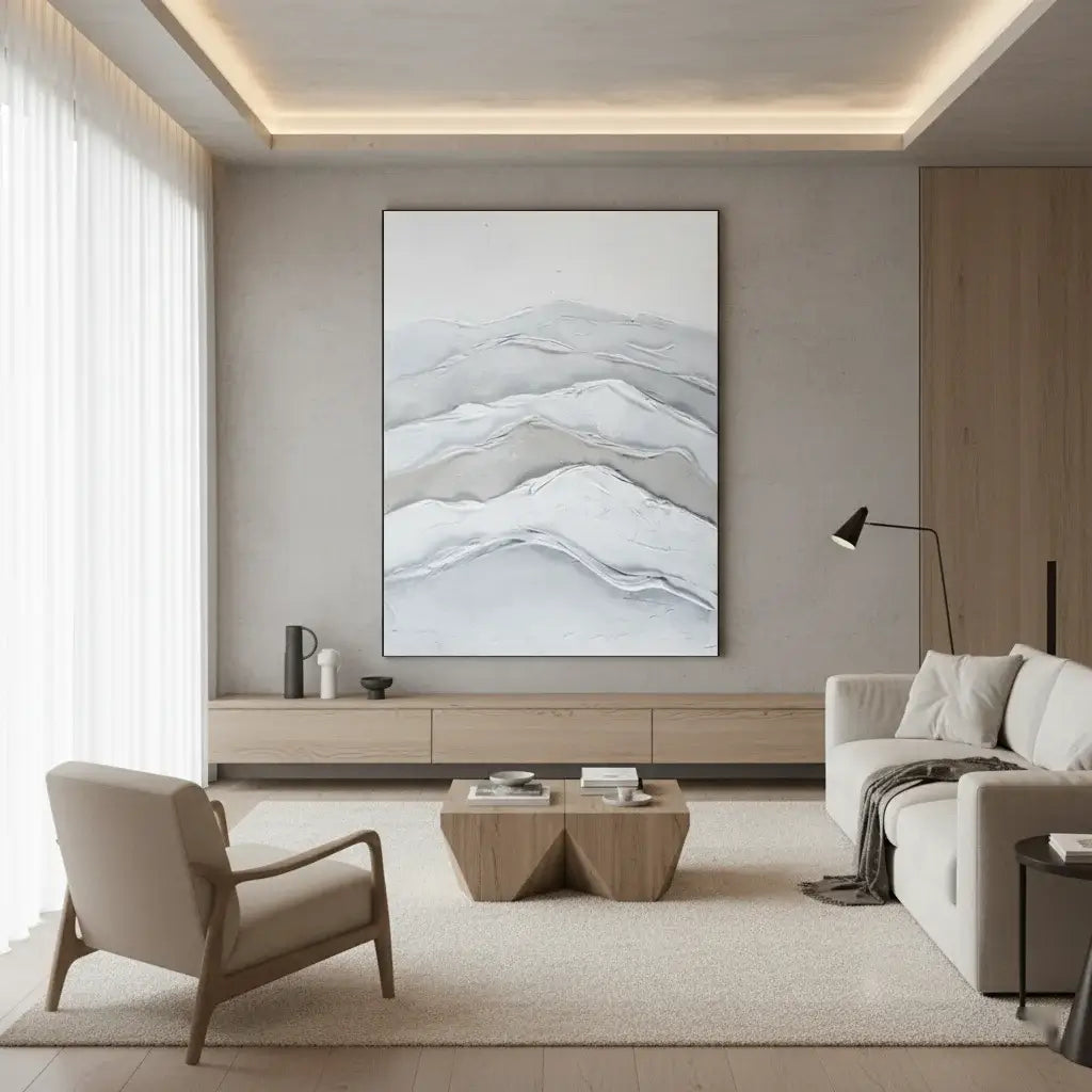 Modern living room with a large abstract painting on the wall, a sofa, armchair, and coffee table.