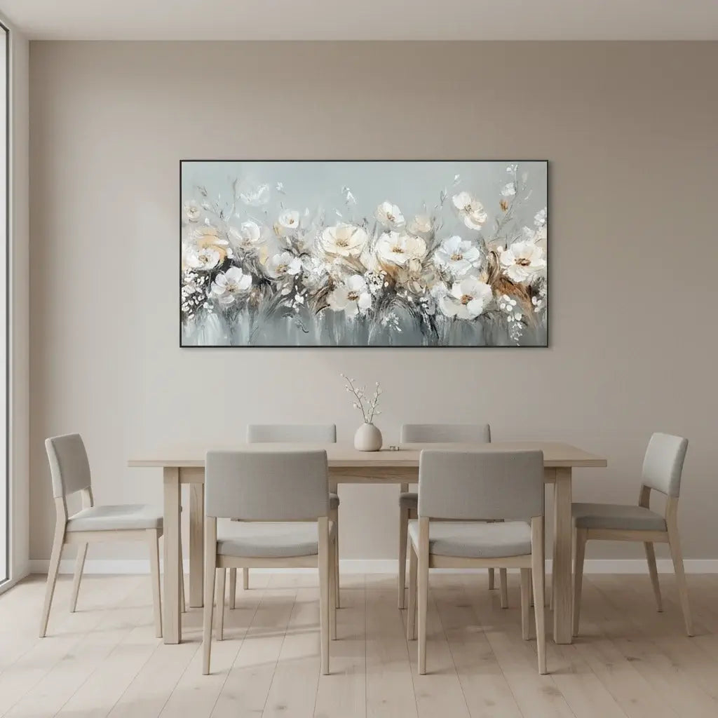 Dining room with a table and chairs, and a floral painting on the wall.