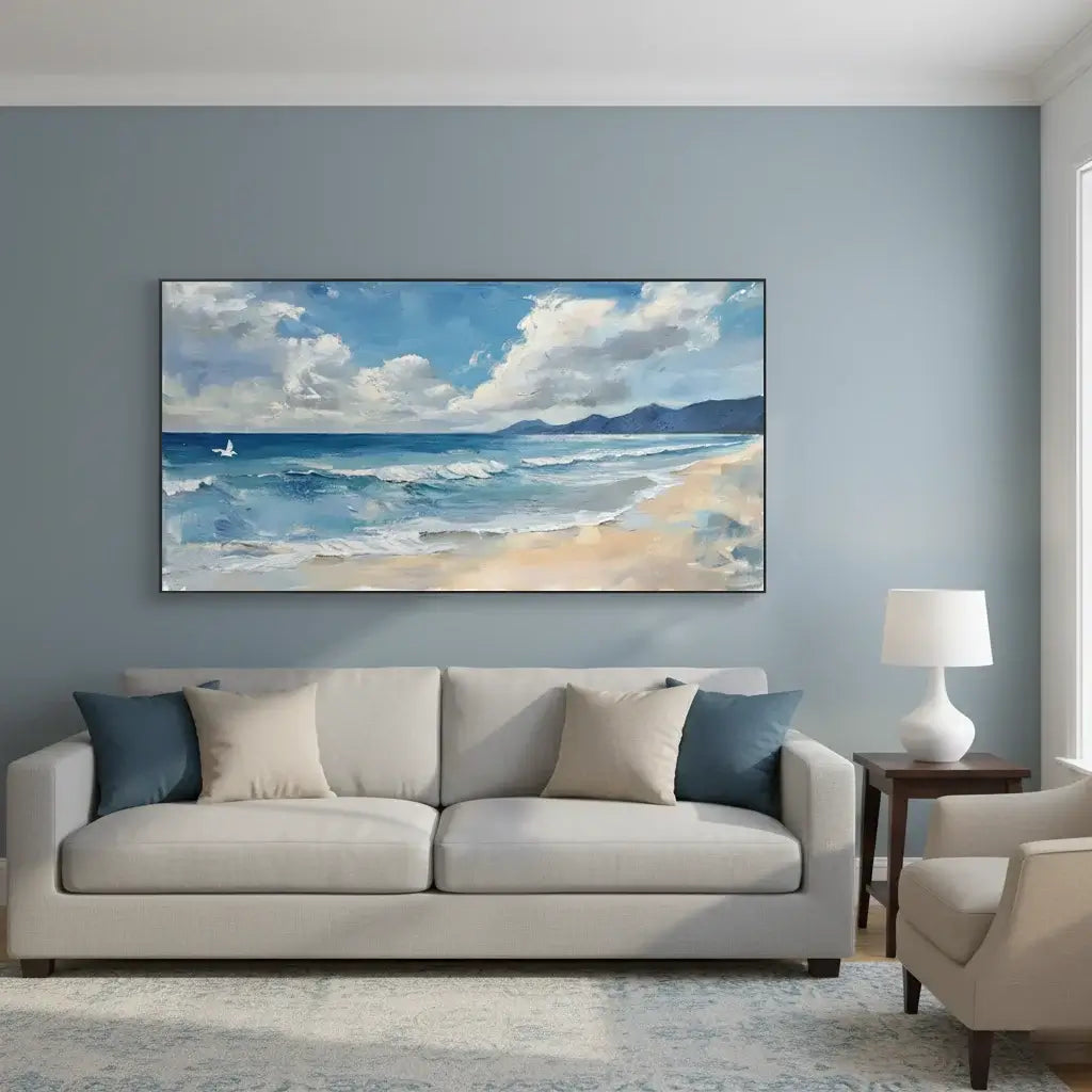 Living room with a large beach scene painting on the wall above a sofa.