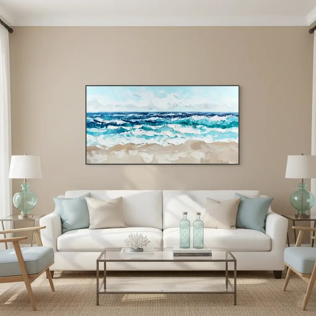 Living room with a white sofa, coffee table, and wall art of a beach scene.