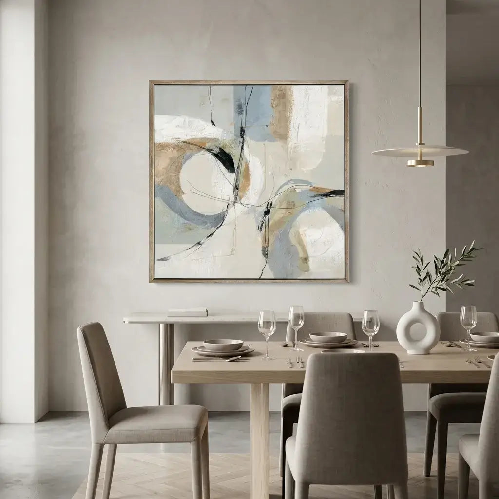 Dining room with a table set for four, abstract art on the wall, and modern pendant light.