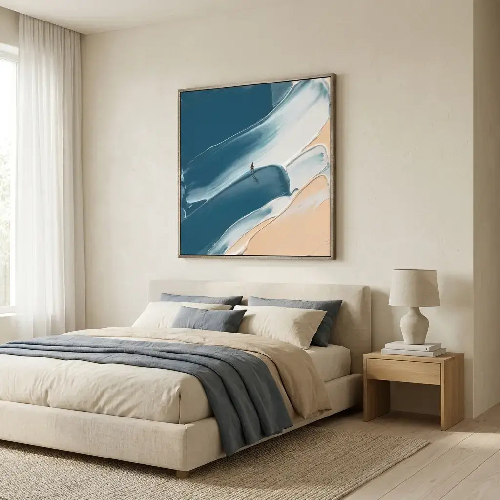 Modern bedroom with a bed, side table, and abstract painting on the wall.