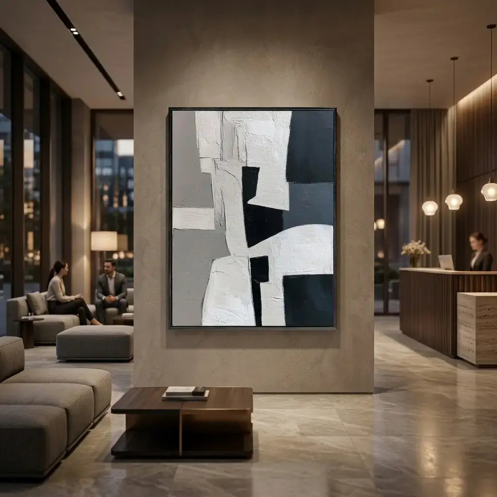 Modern interior with abstract art on a wall, people sitting in the background