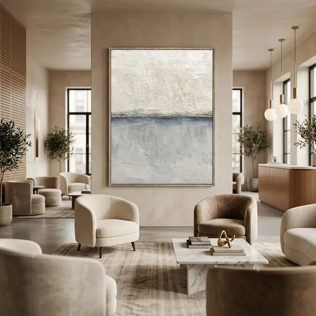 Modern living room with neutral furniture and abstract paintings
