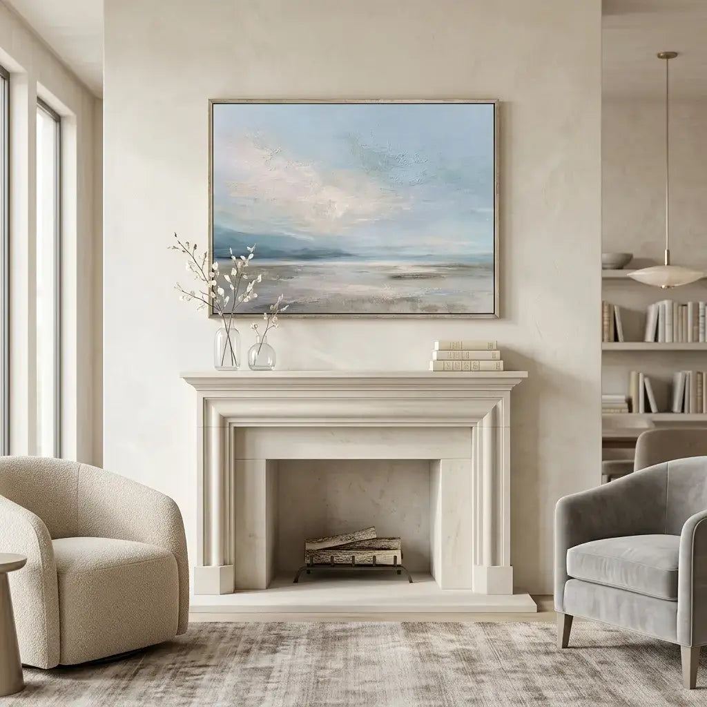 Living room with a fireplace, armchairs, and a painting on the wall.