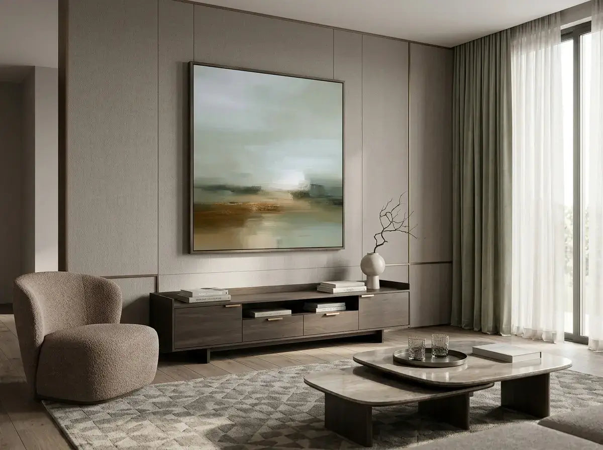 Modern living room with a large abstract painting on the wall, a coffee table, and a chair.