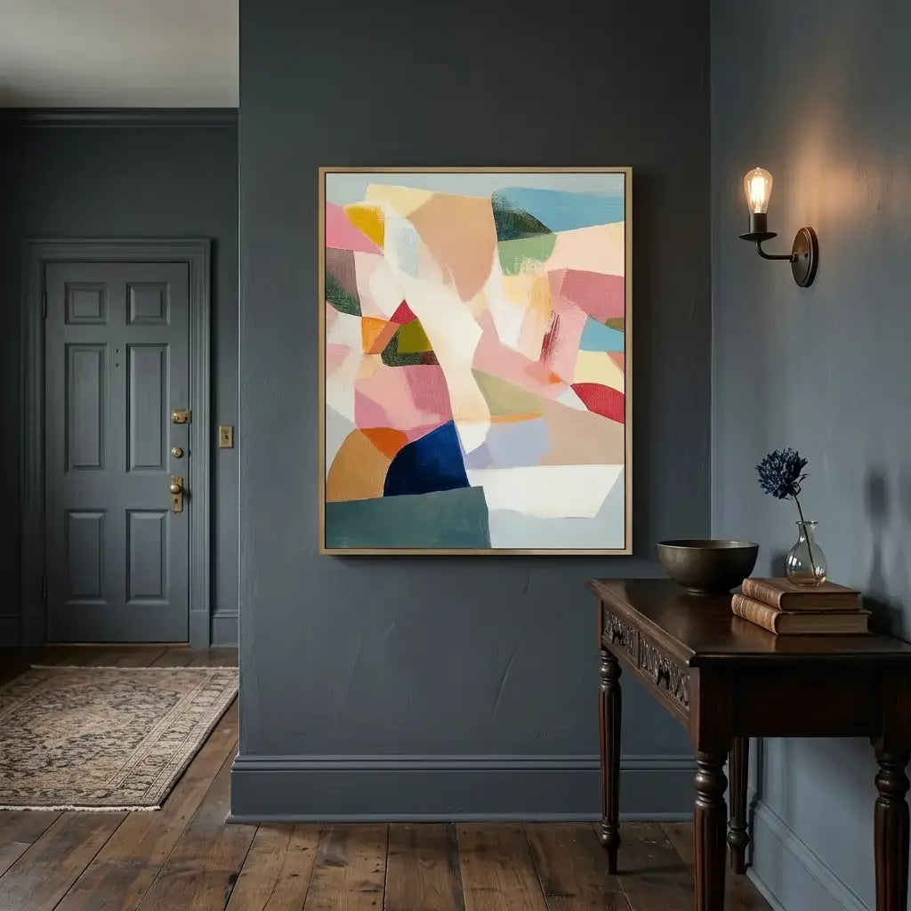 Colorful abstract painting on a gray wall above a wooden console table.