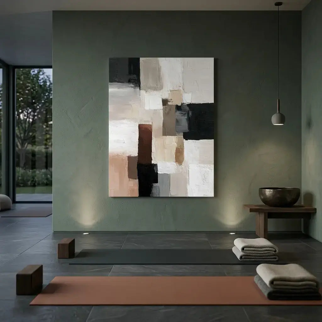Modern interior with abstract painting on a wall, yoga mats, and towels.