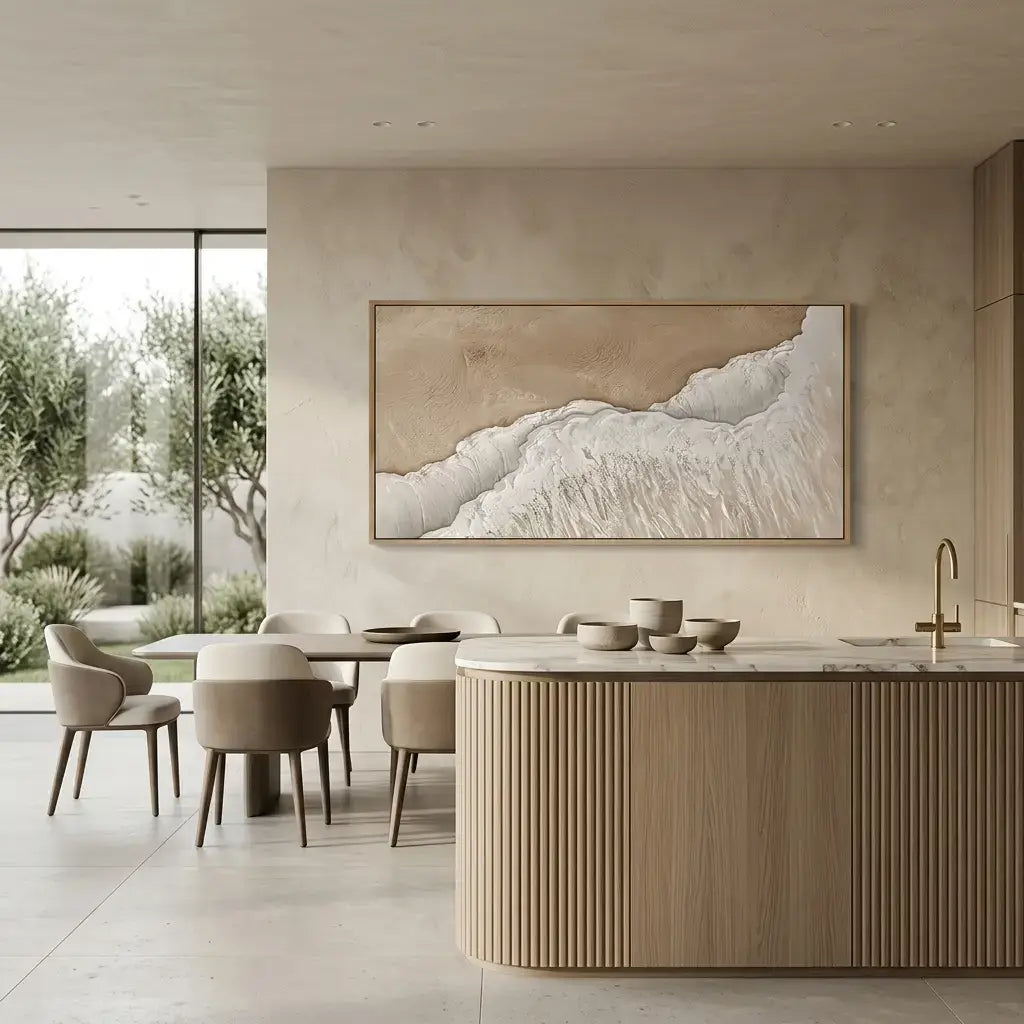 Modern kitchen with marble island, dining table, and abstract wall art.