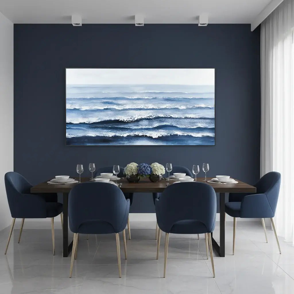 Dining room with a large ocean painting on the wall, featuring a table set for dinner.
