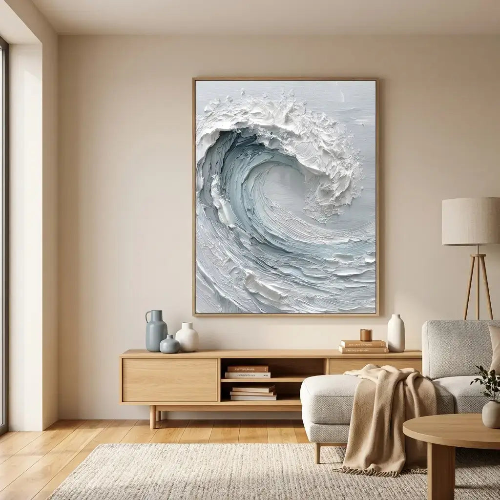 Living room with a large abstract wave painting on the wall, wooden cabinet, and gray sofa.