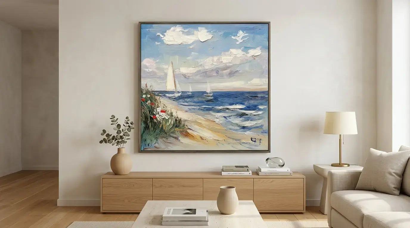 Living room with a large framed painting of a beach scene on the wall.