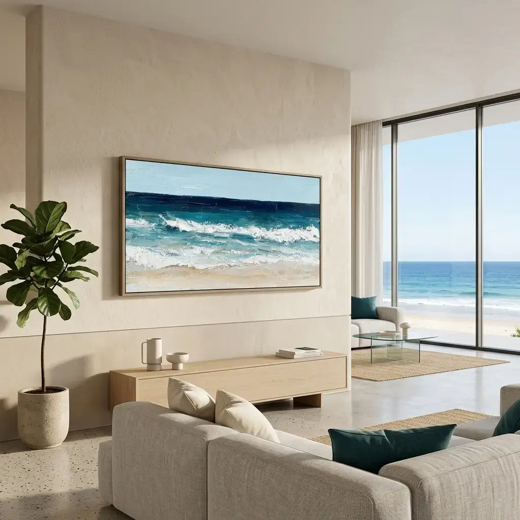 Modern living room with a large TV displaying a beach scene, a sofa, and a plant.