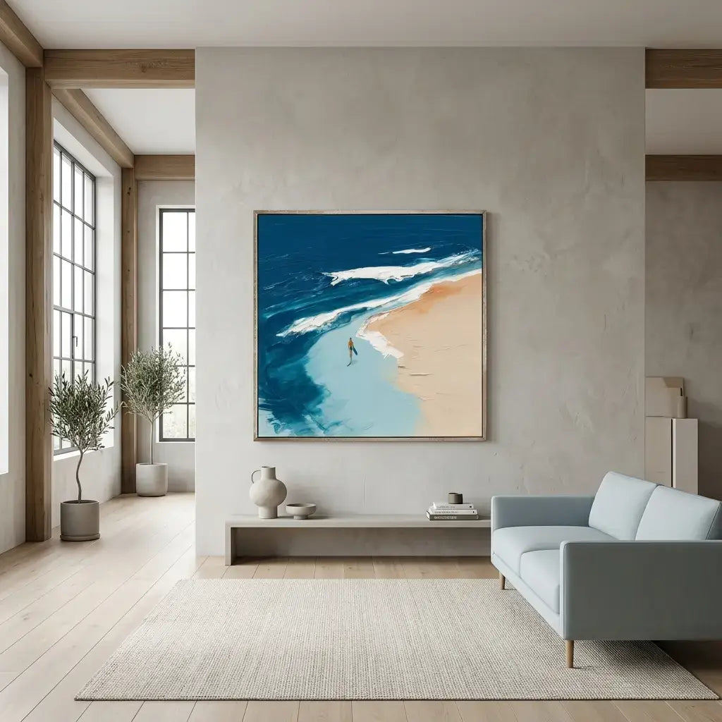 Modern living room with a large abstract painting of a beach scene on the wall.