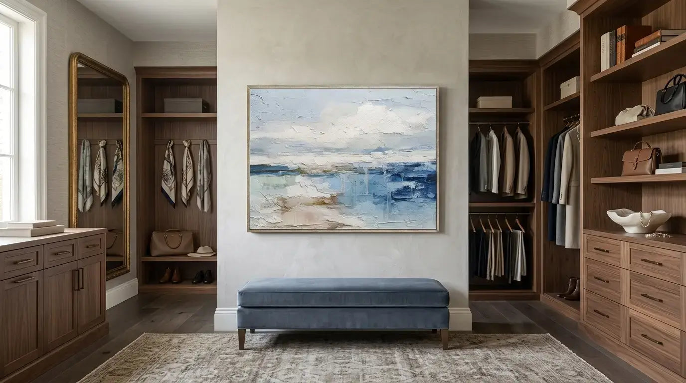 Modern walk-in closet with wooden shelves, clothes, and a large painting on the wall.