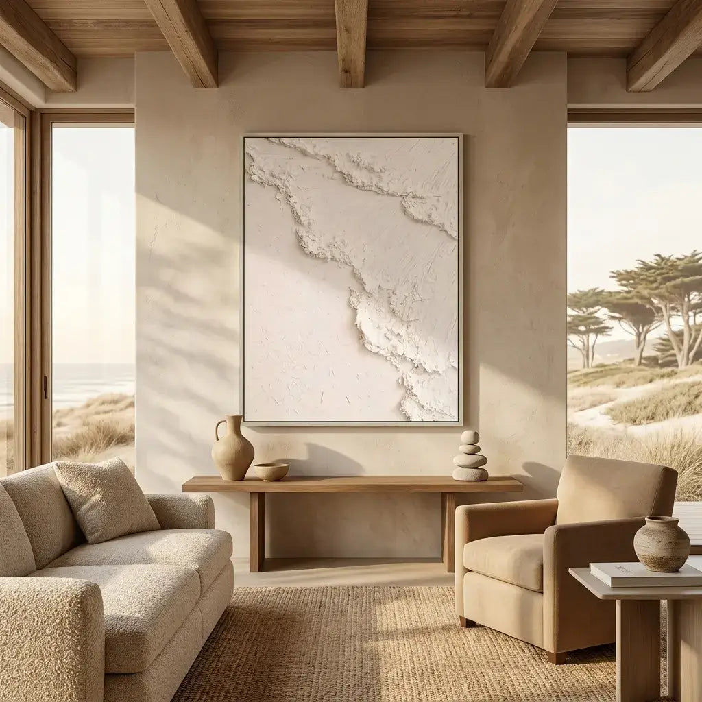 Modern living room with neutral tones, a textured wall art piece, and natural light.