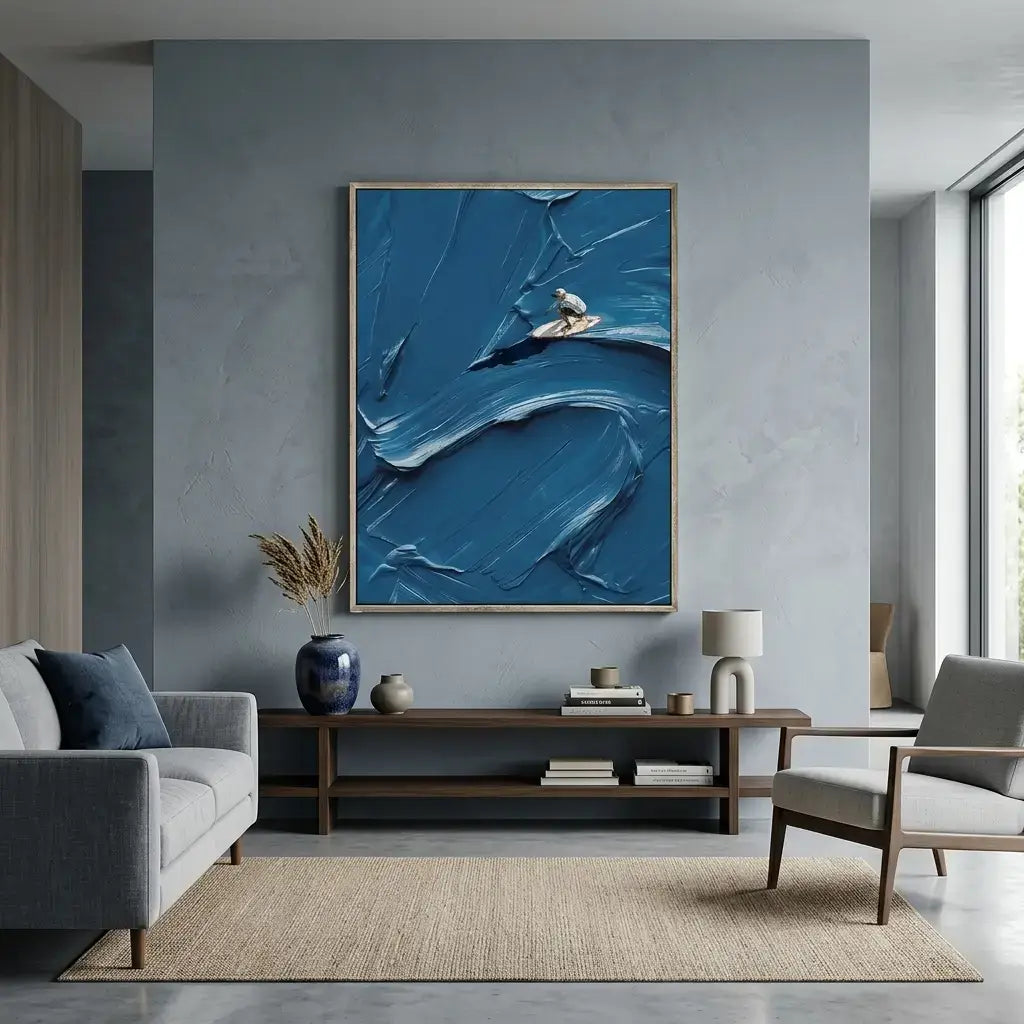 Modern living room with abstract blue artwork on a gray wall