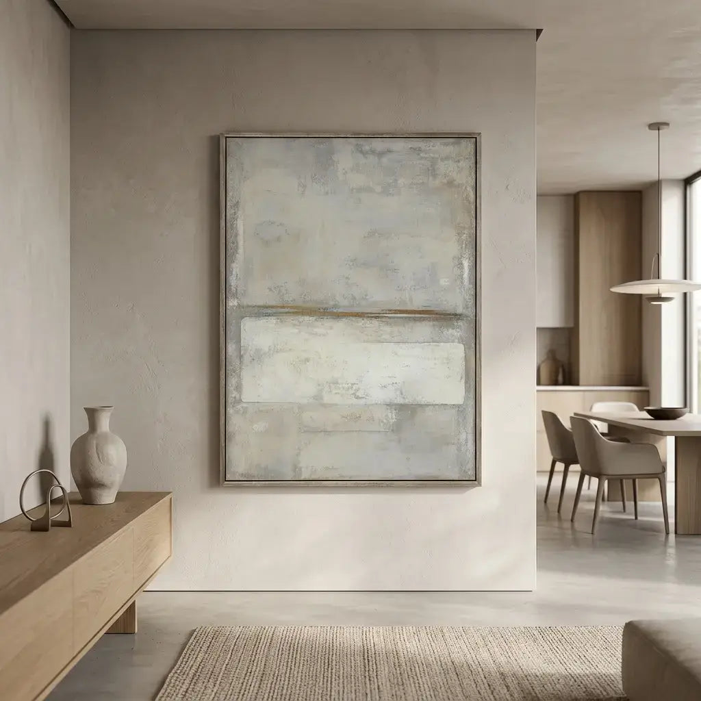 Modern interior with abstract painting on a wall, wooden sideboard, and dining area.