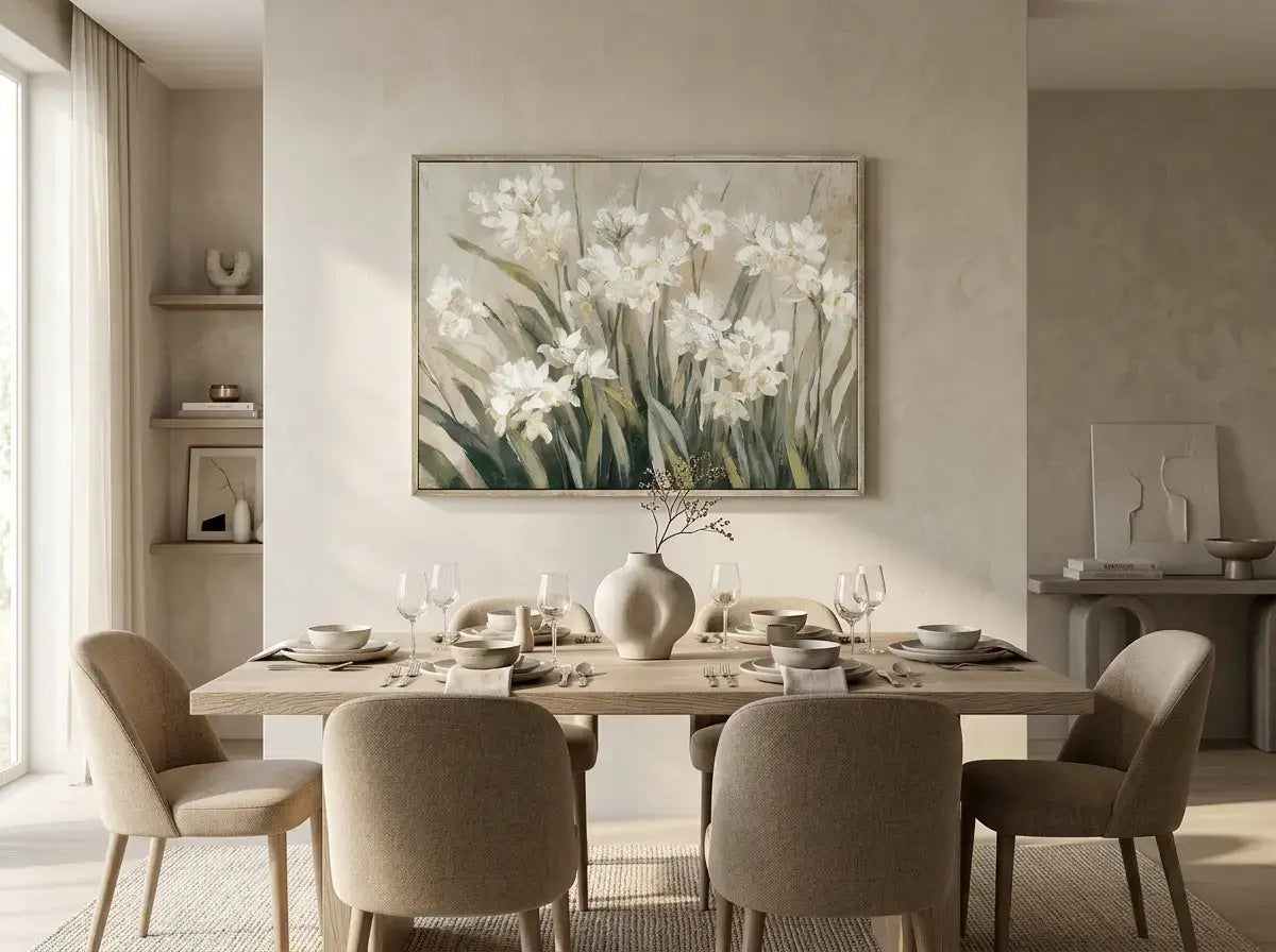 Dining room with a table set for a meal, chairs, and a floral painting on the wall.
