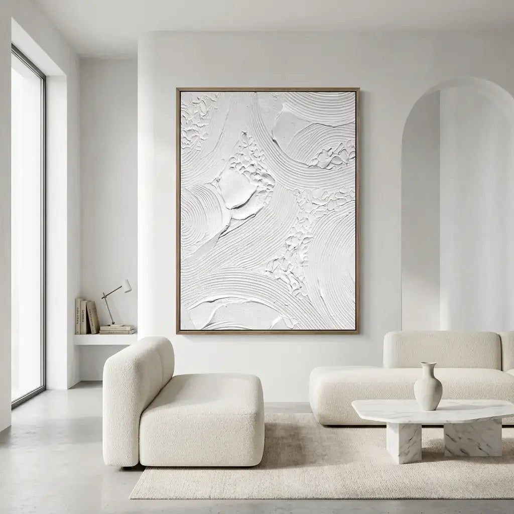 Modern living room with a textured wall art piece and minimal furniture.