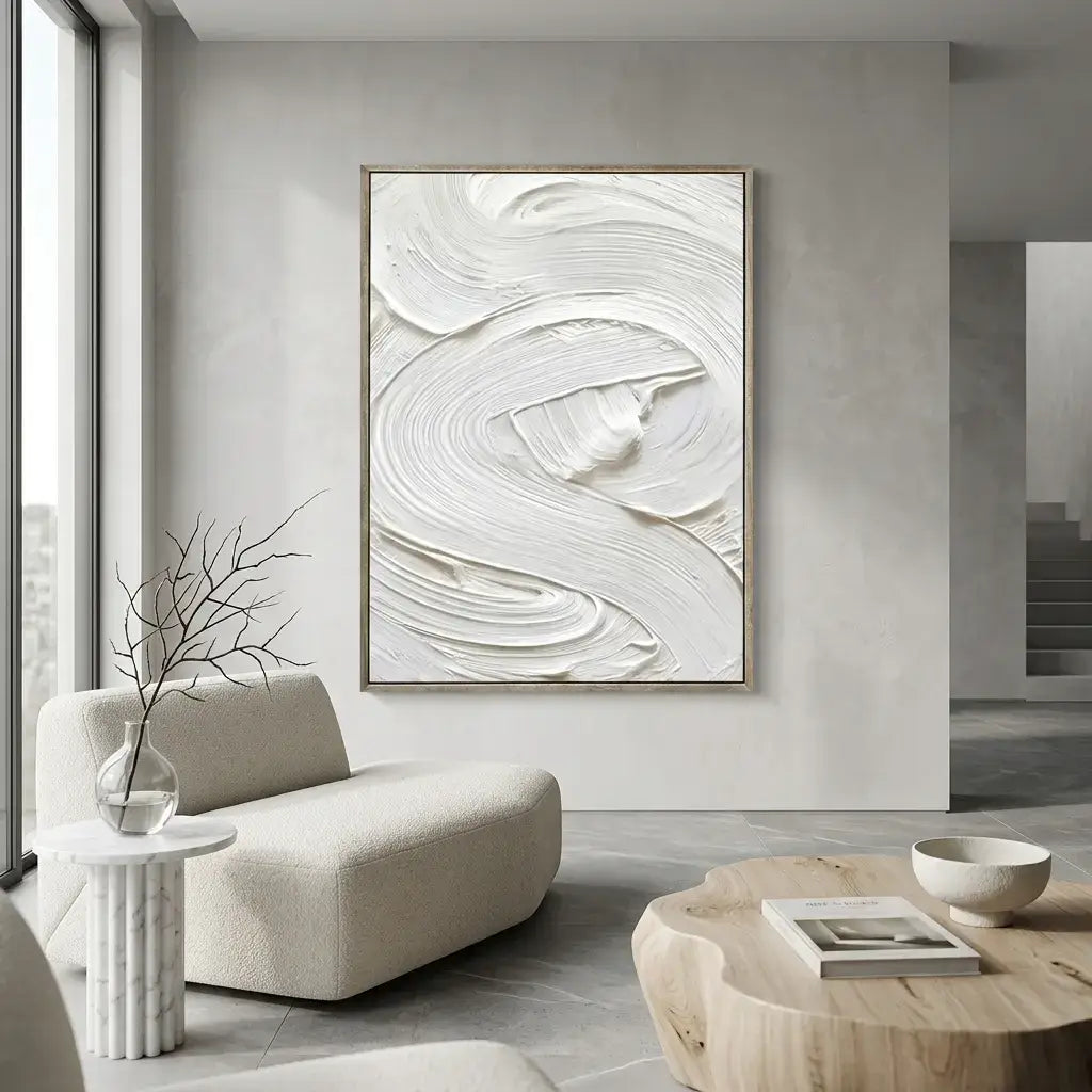 Modern living room with abstract artwork on the wall, a beige armchair, and a wooden coffee table.