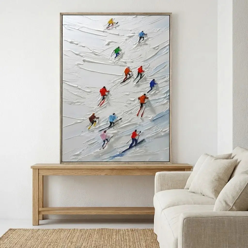 Framed painting of skiers on a snowy landscape above a wooden coffee table in a living room.