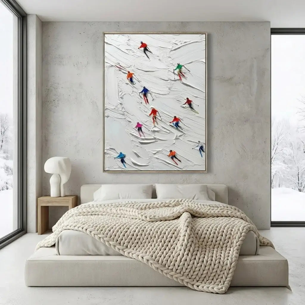 Modern bedroom with a bed, abstract art on the wall, and a side table.