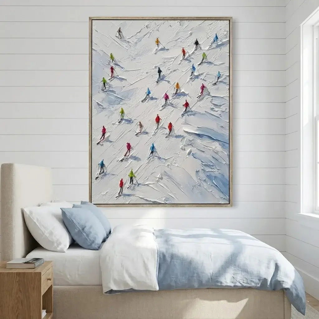 Bedroom with a painting of skiers on a mountain wall above the bed.