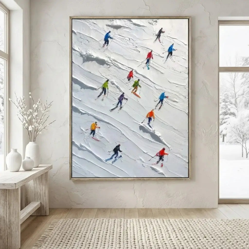 Framed artwork of skiers on a snowy slope in a modern interior setting.