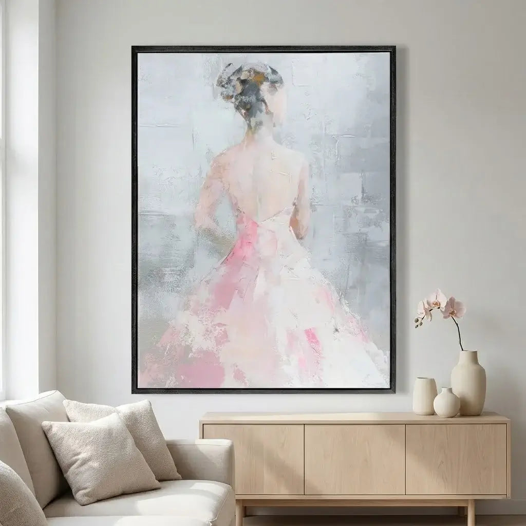 Framed abstract art of a woman in a pink dress in a living room setting.