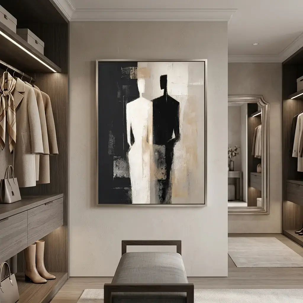 Modern walk-in closet with clothing, a bench, and abstract art on the wall.